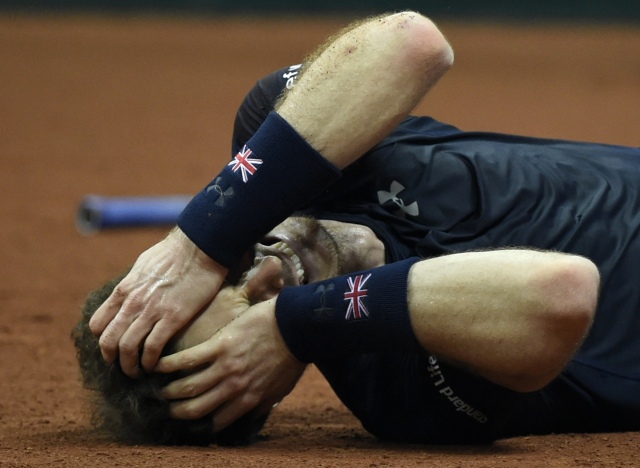 Britain's Andy Murray reacts after winning his tennis match against Belgium's David Goffin to win the Davis Cup final between Belgium and Britain at Flanders Expo in Ghent on November 29, 2015. Britain won the Davis Cup for the first time in 79 years in Ghent on Sunday when Andy Murray defeated David Goffin 6-3, 7-5, 6-3, in the first of the reverse singles for an unbeatable 3-1 lead over Belgium. AFP PHOTO / JOHN THYS / AFP / JOHN THYS