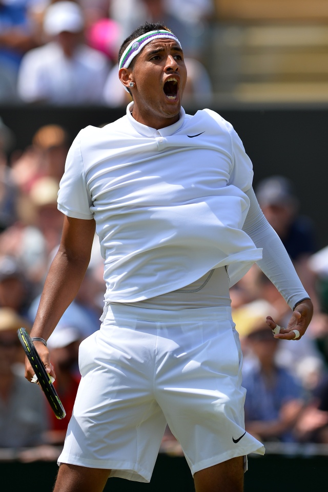 Australia's Nick Kyrgios celebrates winning the second set during his men's singles third round match against Canada's Milos Raonic on day five of the 2015 Wimbledon Championships at The All England Tennis Club in Wimbledon, southwest London, on July 3, 2015. RESTRICTED TO EDITORIAL USE -- AFP PHOTO / GLYN KIRK / AFP / GLYN KIRK